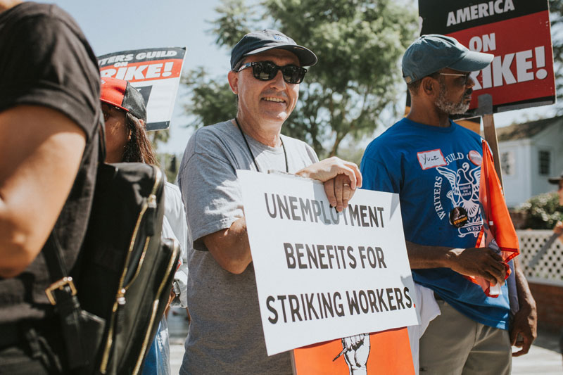 PAC Board Member Patric Verrone rallies with other striking writers and actors in support of unemployment insurance for striking workers.